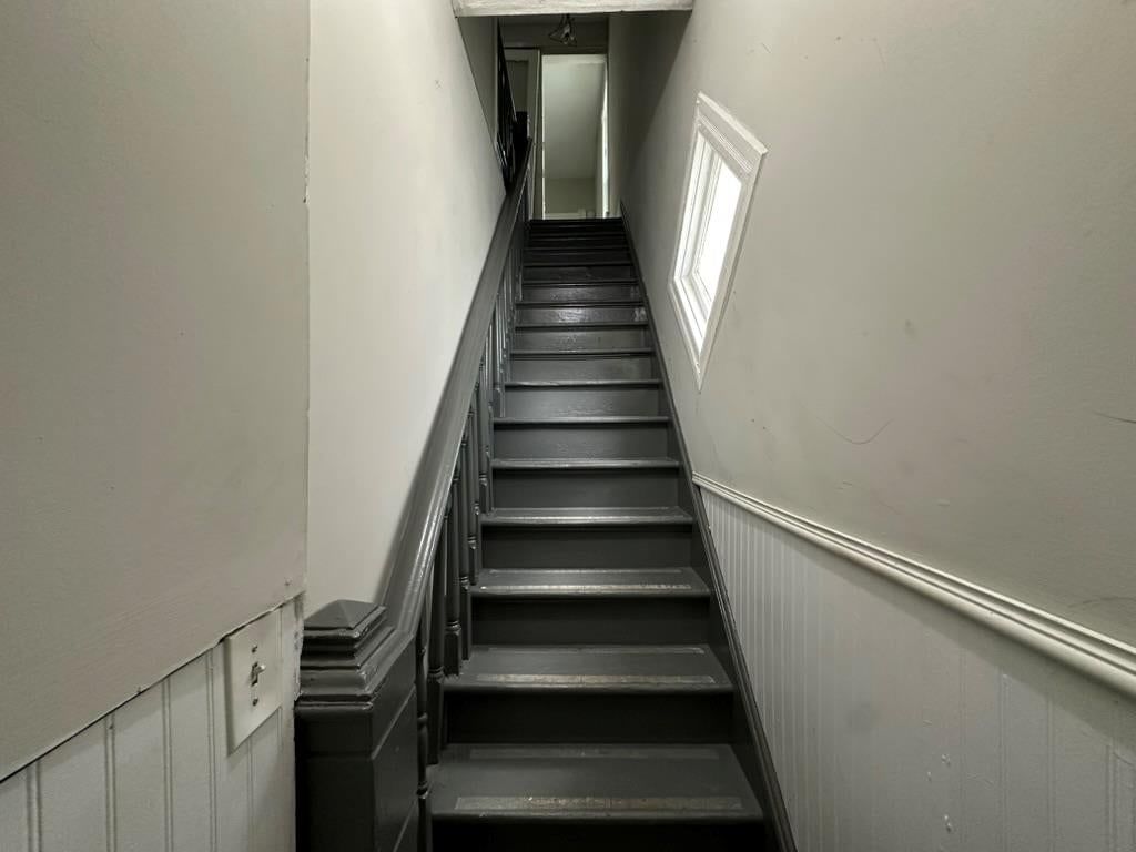 Staircase and wood stair railing at 2807 7th Street E, Kansas City, MO 64124