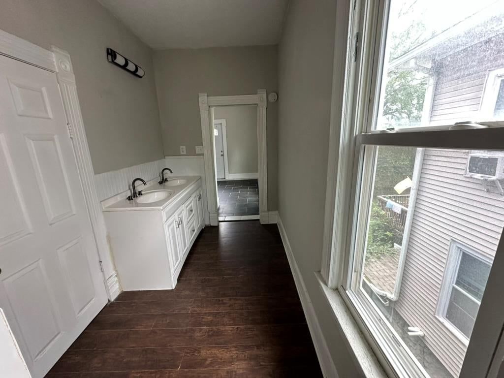 Double vanity, white vanity and tub and shower combo at 2807 7th Street E, Kansas City, MO 64124