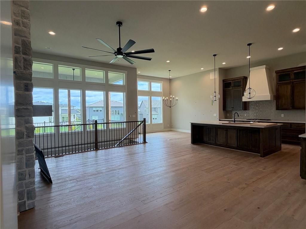 Tall ceilings, open floor plan and floor-to-ceiling windows at 18461 Pawnee Lane, Overland Park, KS 66085