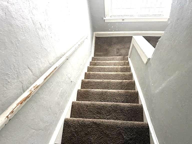 Staircase and wood stair railing at 3249 E 28th Street, Kansas City, MO 64128