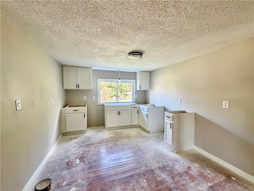 White kitchen at 1611 SE Willow Road, Lee's Summit, MO 64081