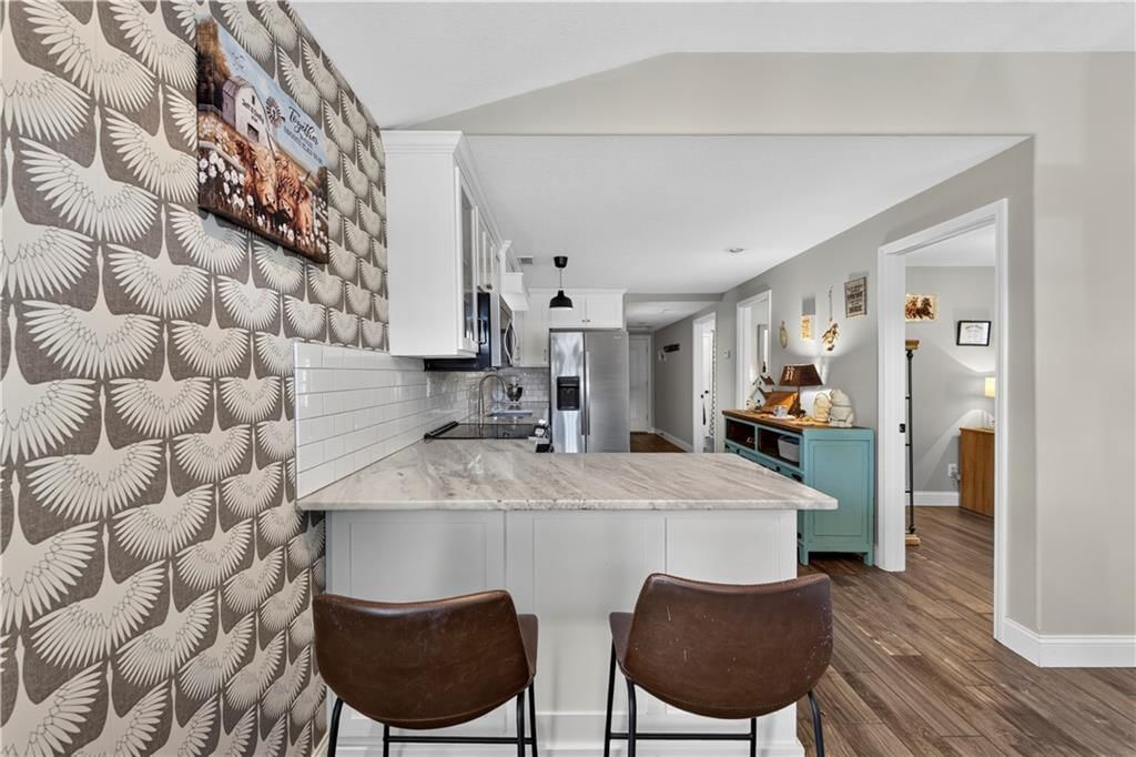 Exposed brick wall, shiplap / paneling and accent wall at 112 W Main Street, Freeman, MO 64746
