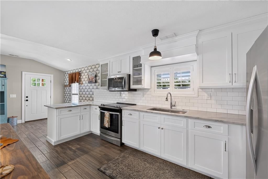 White kitchen, double oven and stainless steel appliances at 112 W Main Street, Freeman, MO 64746