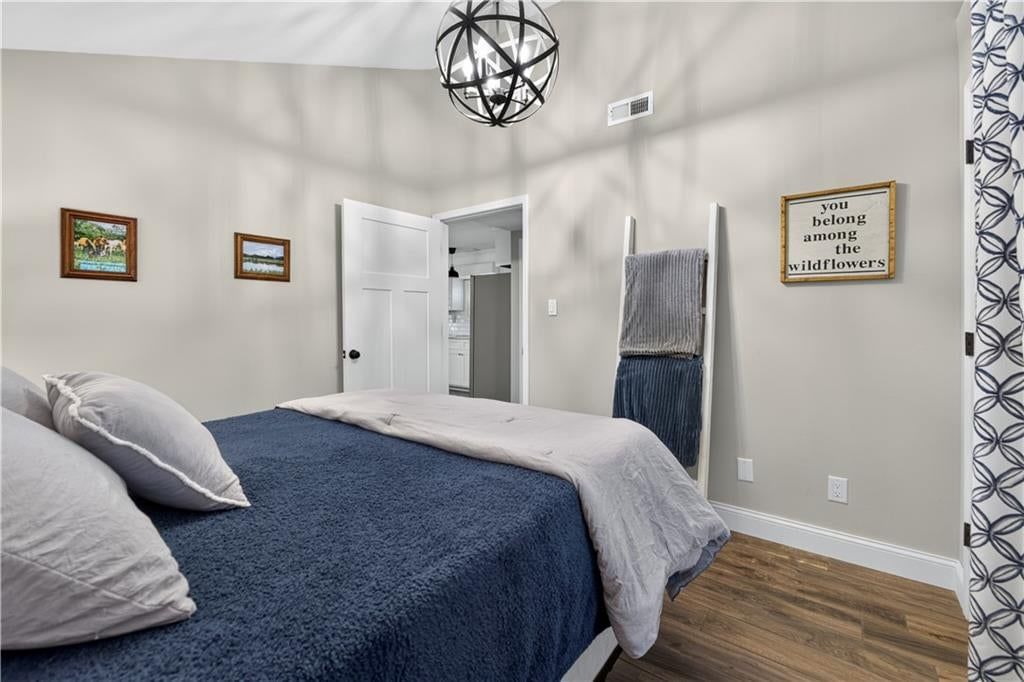 Gray vanity and renovated bathrooms at 112 W Main Street, Freeman, MO 64746