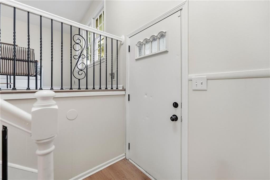 Staircase, iron stair railing and black hardware at 1913 N Plymouth Road, Independence, MO 64058
