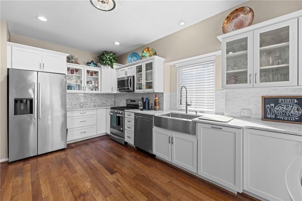 Gas range and glass-front cabinets at 628 NE 93rd Street, Kansas City, MO 64155