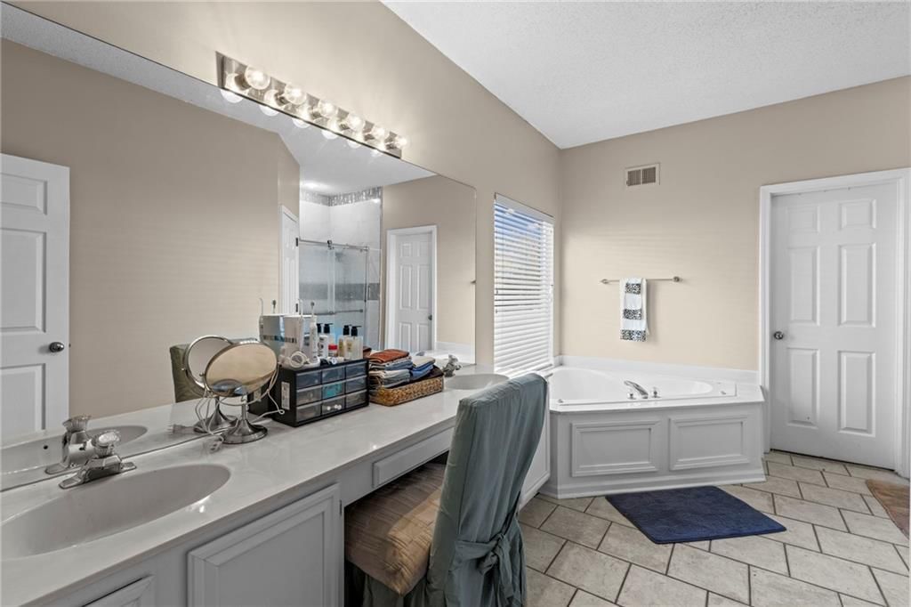 Double vanity and white vanity at 628 NE 93rd Street, Kansas City, MO 64155