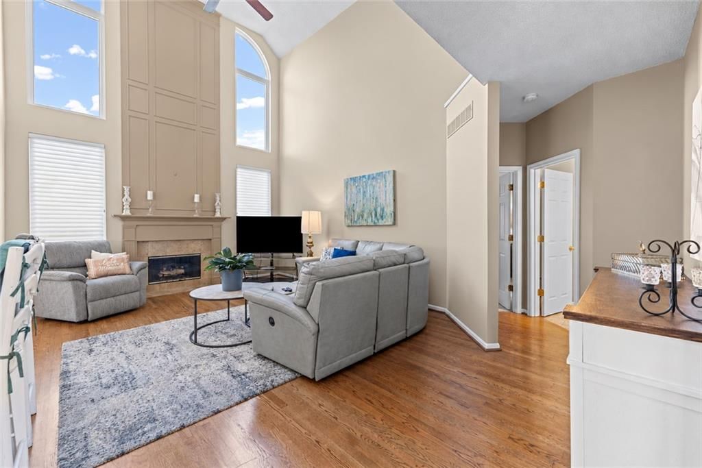 Tall ceilings, wall of windows and two-story fireplace at 628 NE 93rd Street, Kansas City, MO 64155