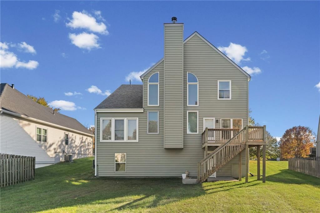 Big backyard, fenced yard and mature trees at 628 NE 93rd Street, Kansas City, MO 64155