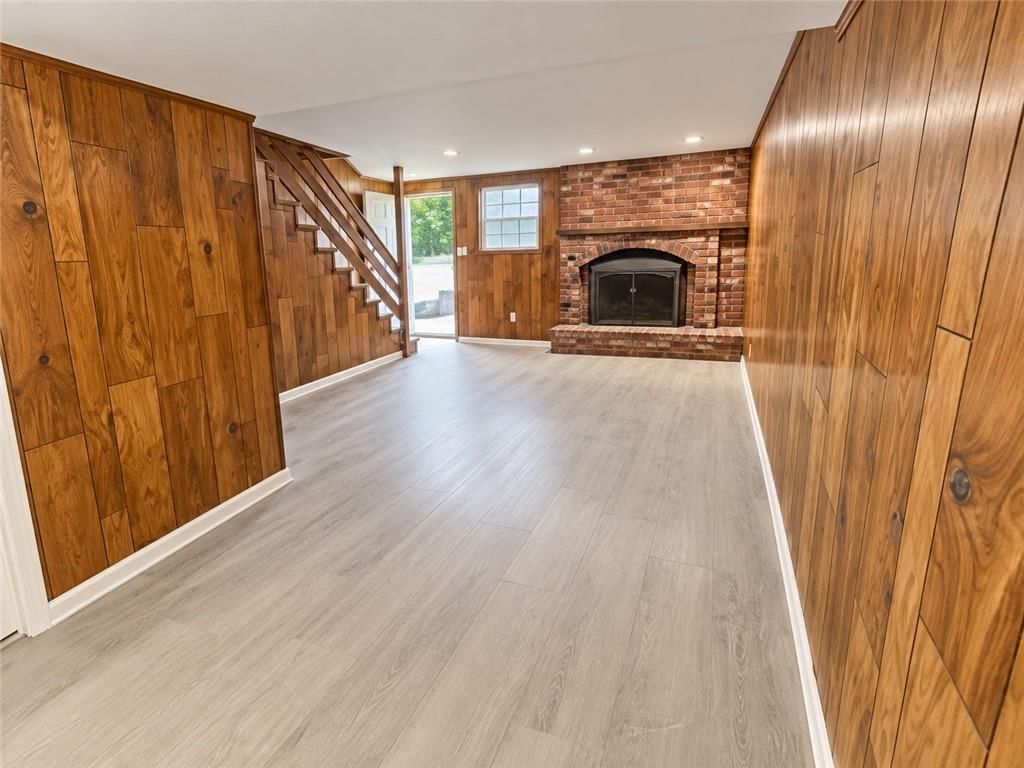 Finished basement, fireplace and exposed brick wall at 1201 N 64th Street, Kansas City, KS 66102
