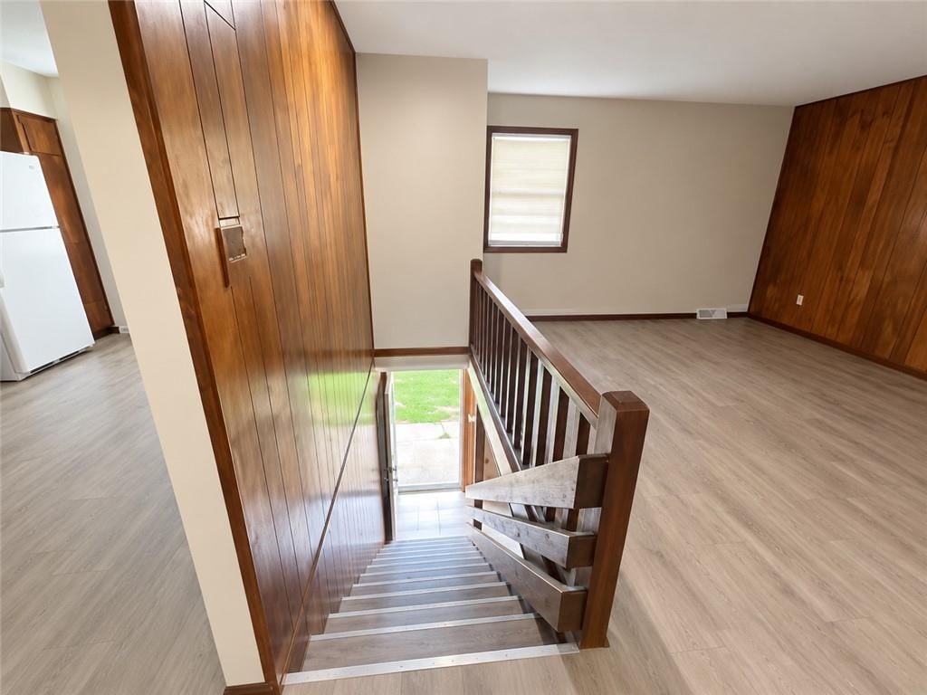 Wood stair railing at 1201 N 64th Street, Kansas City, KS 66102
