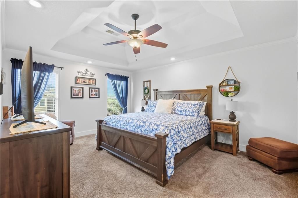 Coffered ceiling, tray ceiling and carpet at 110 S Eastglen Drive, Raymore, MO 64083