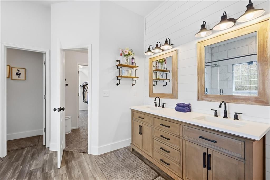 Double vanity and wood vanity at 110 S Eastglen Drive, Raymore, MO 64083