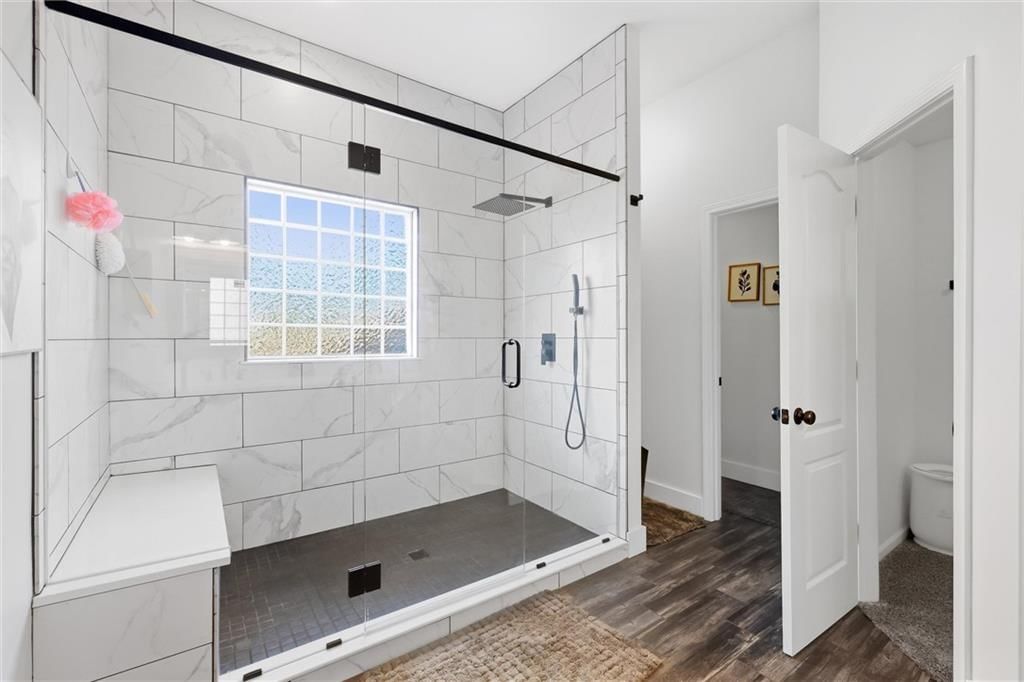 Walk-in shower, tiled shower and frameless glass shower at 110 S Eastglen Drive, Raymore, MO 64083