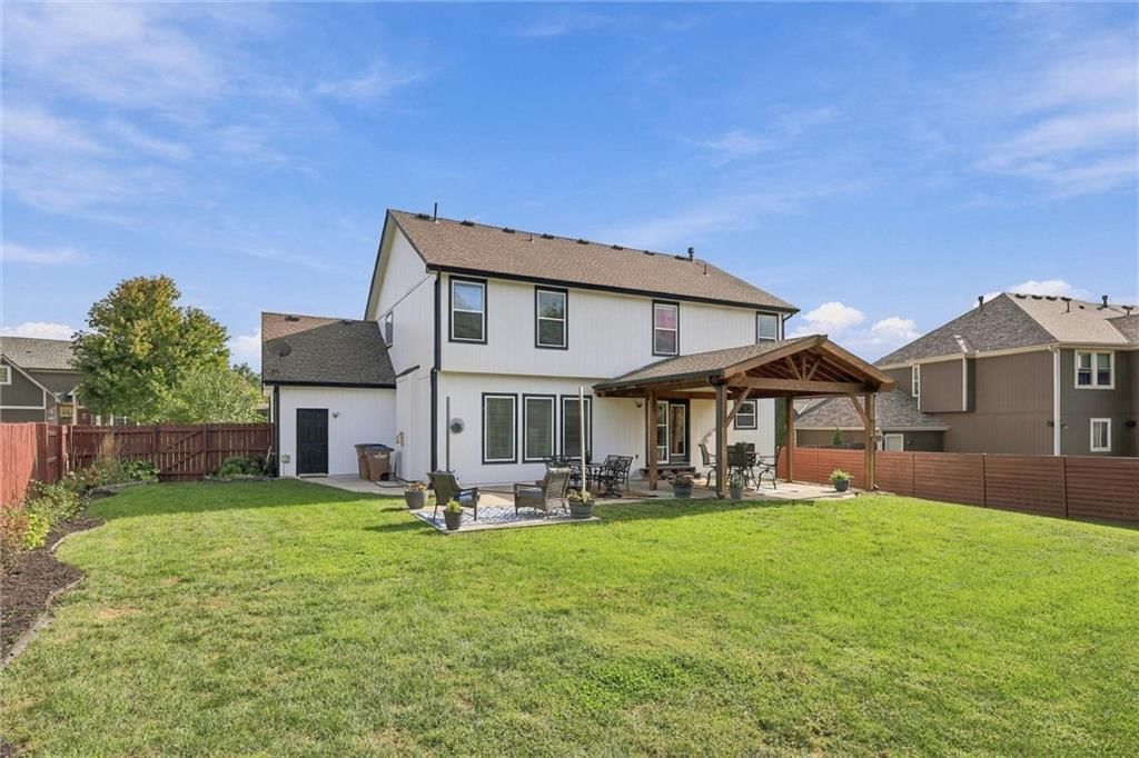 Pergola and covered patio at 110 S Eastglen Drive, Raymore, MO 64083