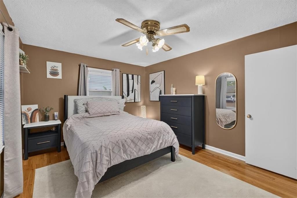Main-floor primary bedroom and carpet at 3611 S Spring Street, Independence, MO 64055