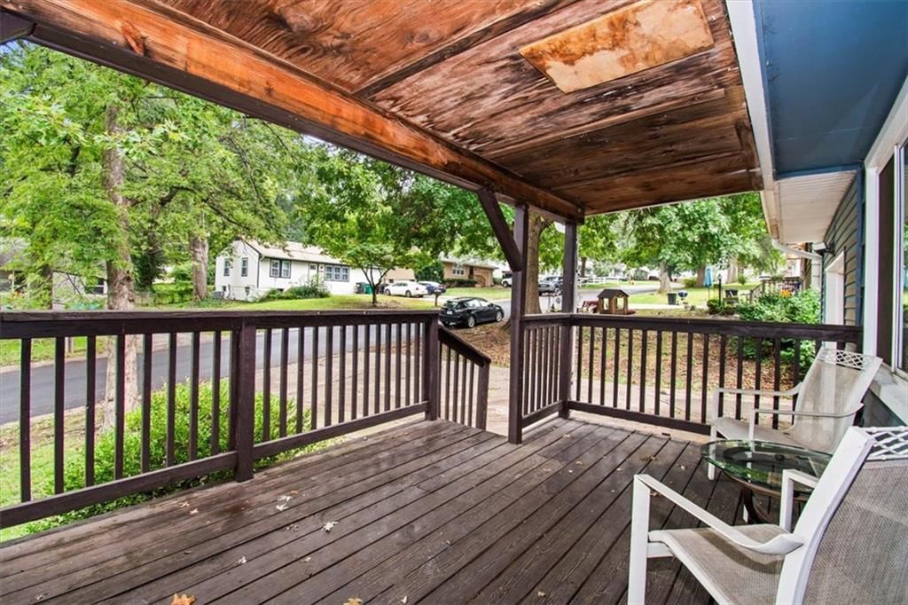 Covered front porch, deck and composite deck at 1708 N Kiger Road, Independence, MO 64050