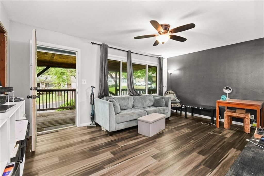 Finished basement, open floor plan and luxury vinyl floors at 1708 N Kiger Road, Independence, MO 64050