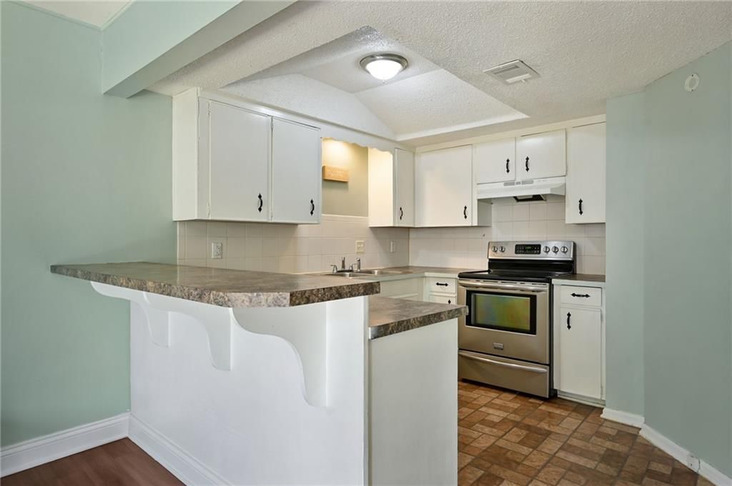 Kitchen island at 6208 E 129th Street, Grandview, MO 64030