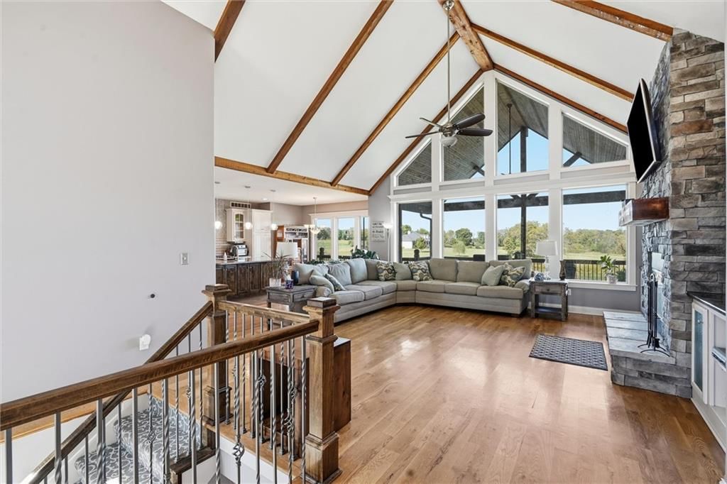 Tall ceilings, fireplace and open floor plan at 13012 E Lone Jack Lee's Summit Road, Lone Jack, MO 64086
