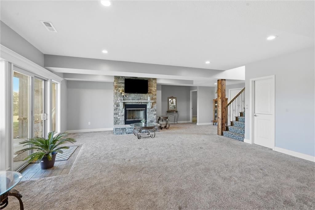 Big backyard, mature trees and in-ground pool at 13012 E Lone Jack Lee's Summit Road, Lone Jack, MO 64086