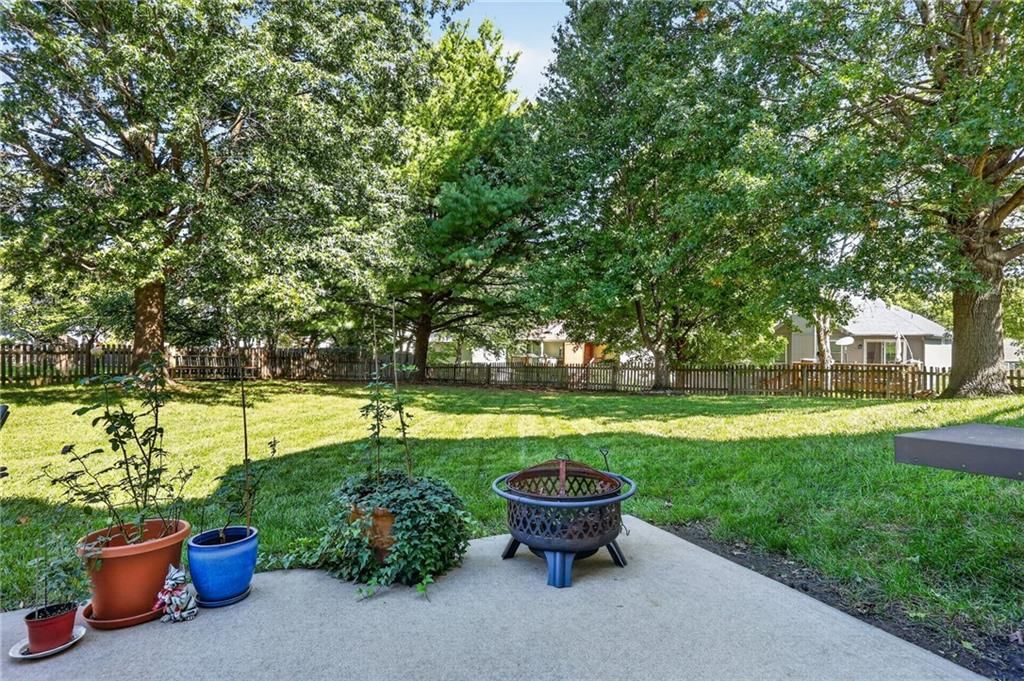 Big backyard, fenced yard and mature trees at 7608 NW 76th Place, Kansas City, MO 64152