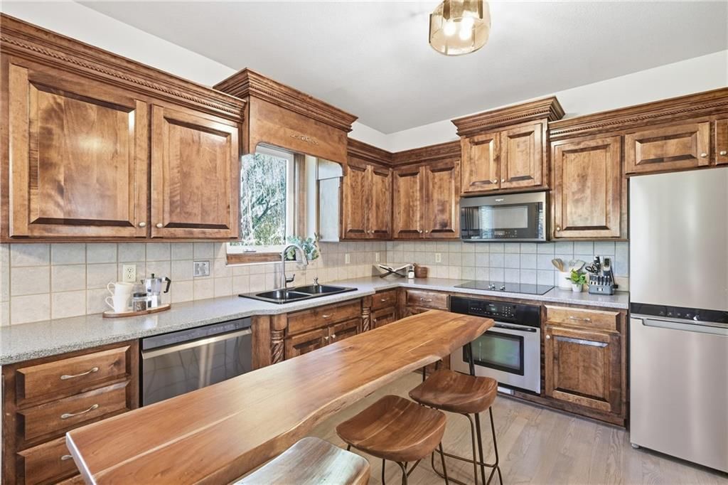Kitchen island and breakfast nook at 10429 N Lawn Avenue, Kansas City, MO 64156