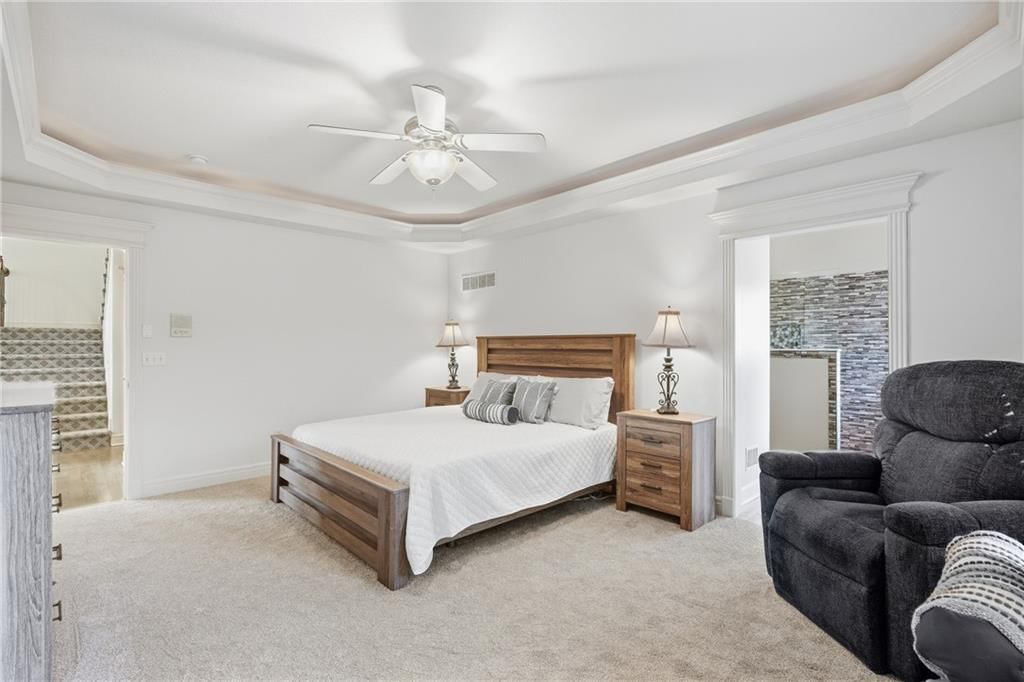 Main-floor primary bedroom at 10429 N Lawn Avenue, Kansas City, MO 64156