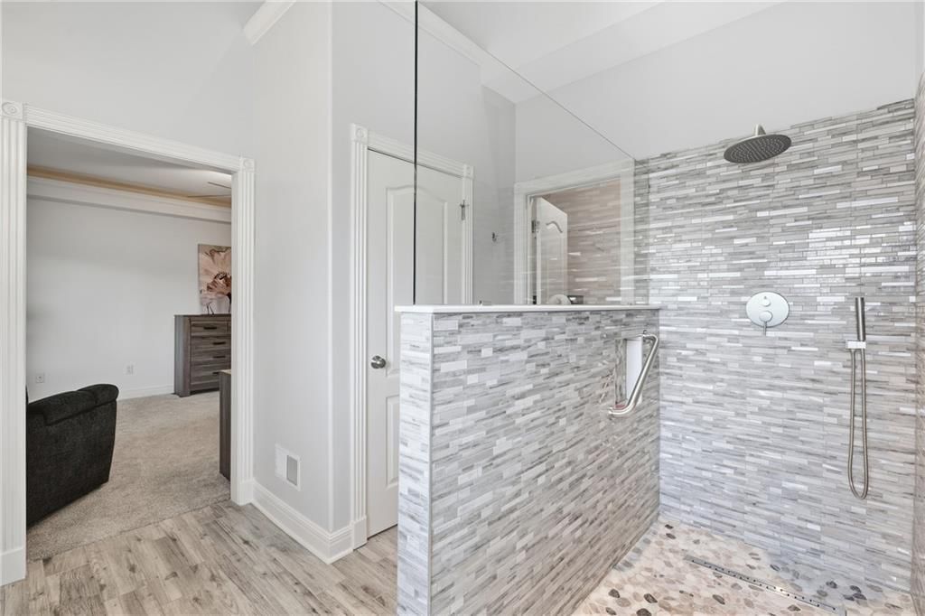 Walk-in shower, tiled shower and frameless glass shower at 10429 N Lawn Avenue, Kansas City, MO 64156