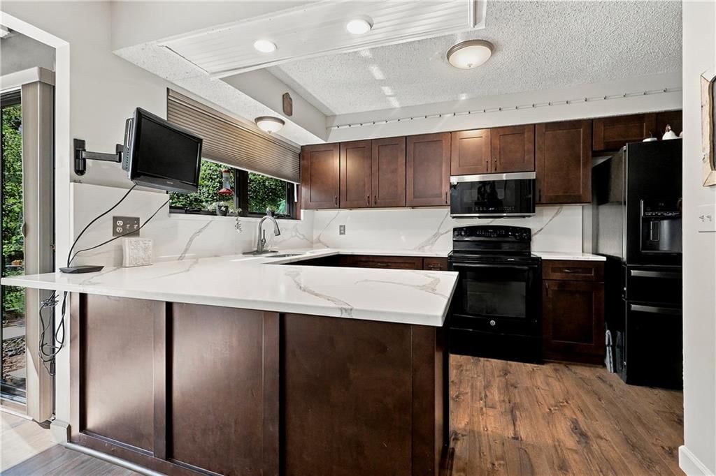 Shaker cabinets, kitchen backsplash and slab backsplash at 30750 W 143rd Street, Gardner, KS 66030