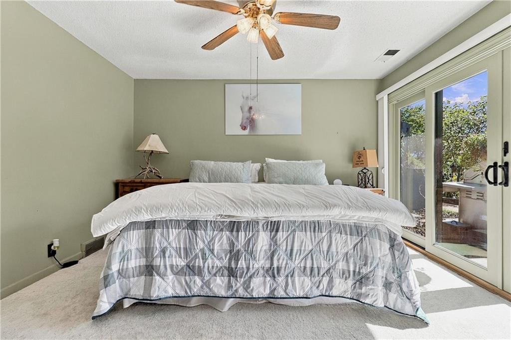 Main-floor primary bedroom and carpet at 30750 W 143rd Street, Gardner, KS 66030