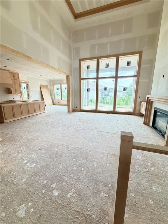 Tall ceilings, open floor plan and floor-to-ceiling windows at 10910 W 173rd Terrace, Overland Park, KS 66221
