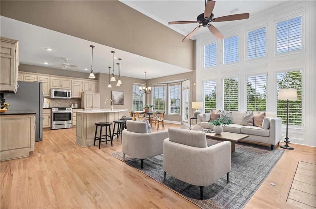 Open floor plan, floor-to-ceiling windows and tall ceilings at 20306 W 99th Terrace, Lenexa, KS 66220