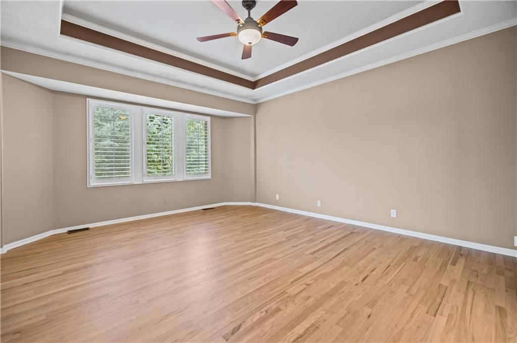 Tray ceiling and main-floor primary bedroom at 20306 W 99th Terrace, Lenexa, KS 66220