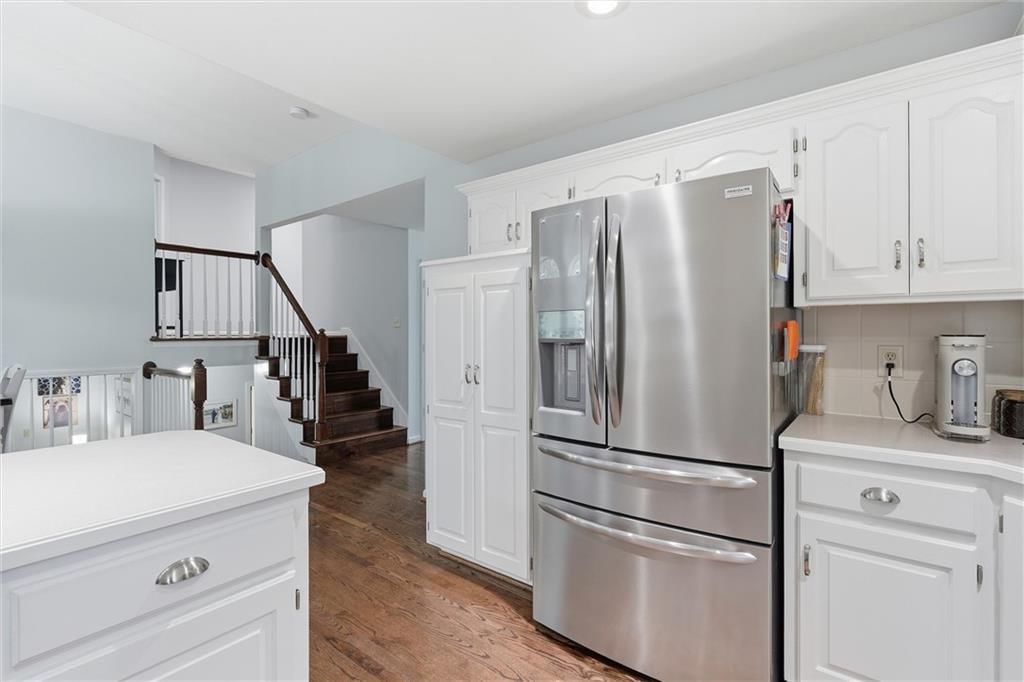 Tall ceilings, open floor plan and hardwood floors at 1104 Regency Drive, Kearney, MO 64060