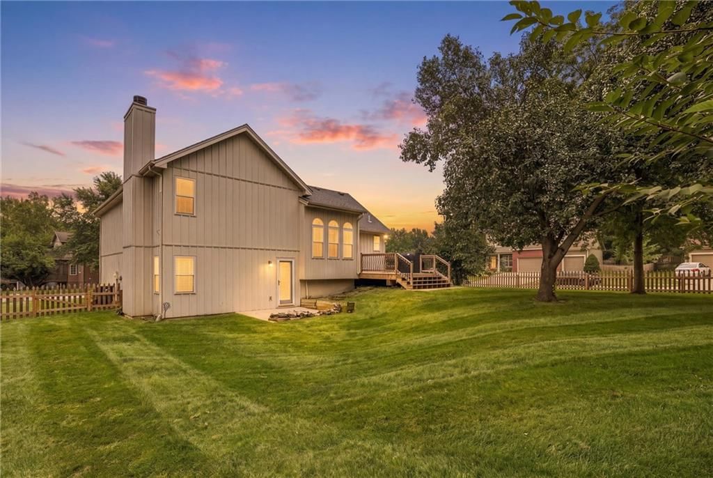 Big backyard, fenced yard and mature trees at 1104 Regency Drive, Kearney, MO 64060
