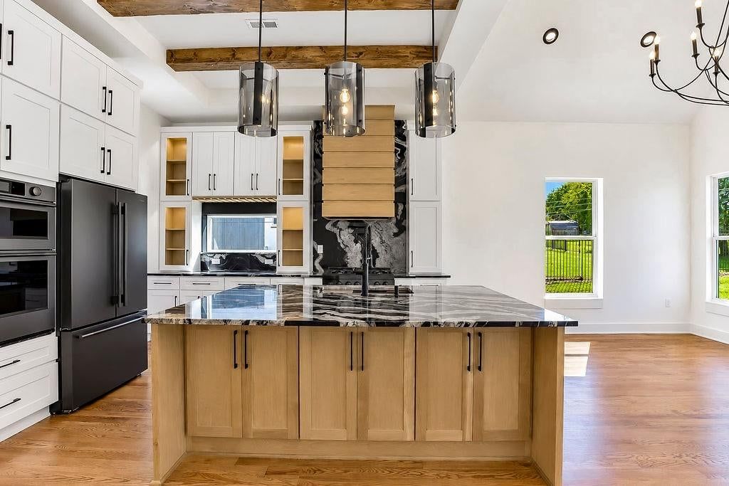 Statement lighting, double oven and ceiling beams at 2738 N 86th Terrace, Kansas City, KS 66109