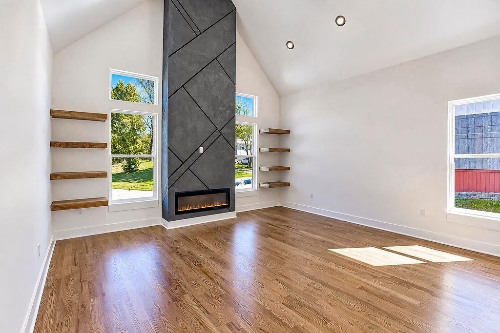 Tall ceilings, fireplace and wall of windows at 2738 N 86th Terrace, Kansas City, KS 66109