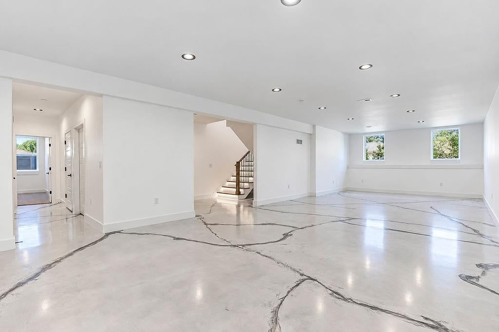 Finished basement and open-riser staircase at 2738 N 86th Terrace, Kansas City, KS 66109