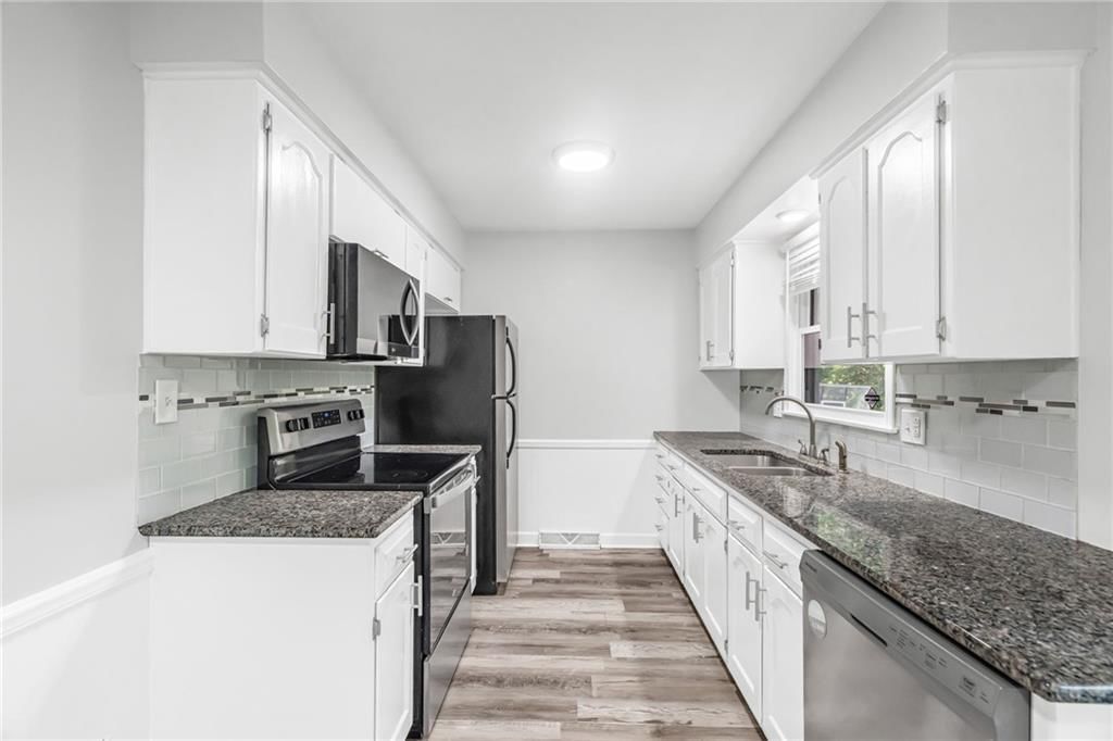 7644 NW Milrey Drive — photo 13