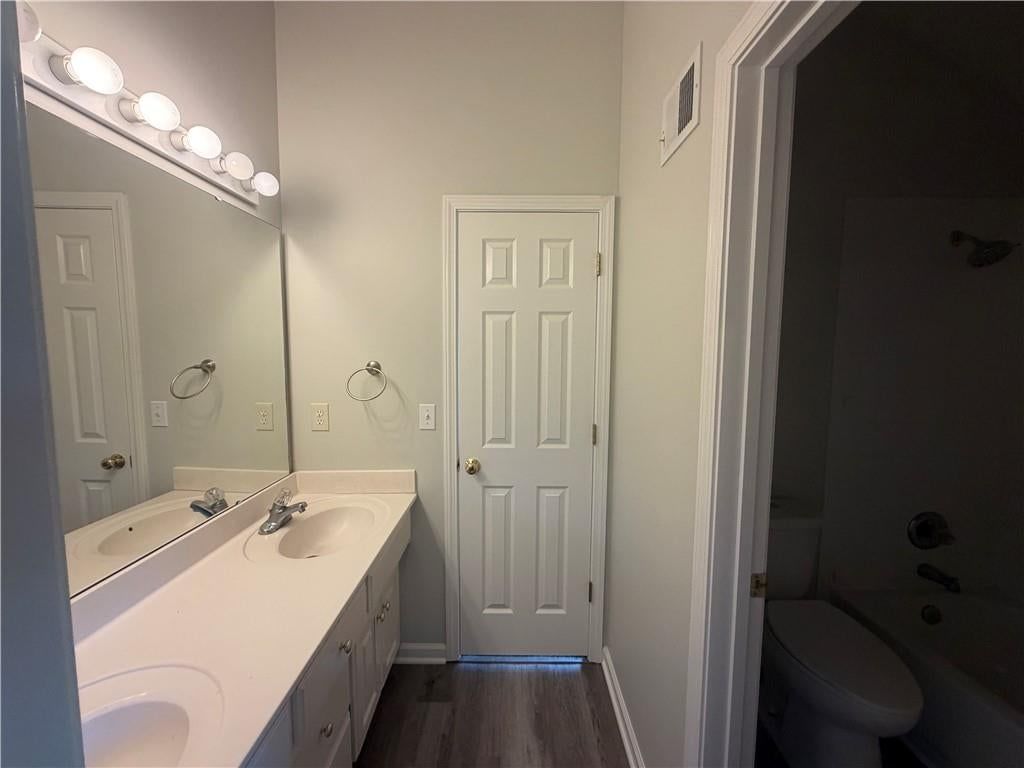 Tile floors, tiled shower and double vanity at 7825 W 143rd Place, Overland Park, KS 66223
