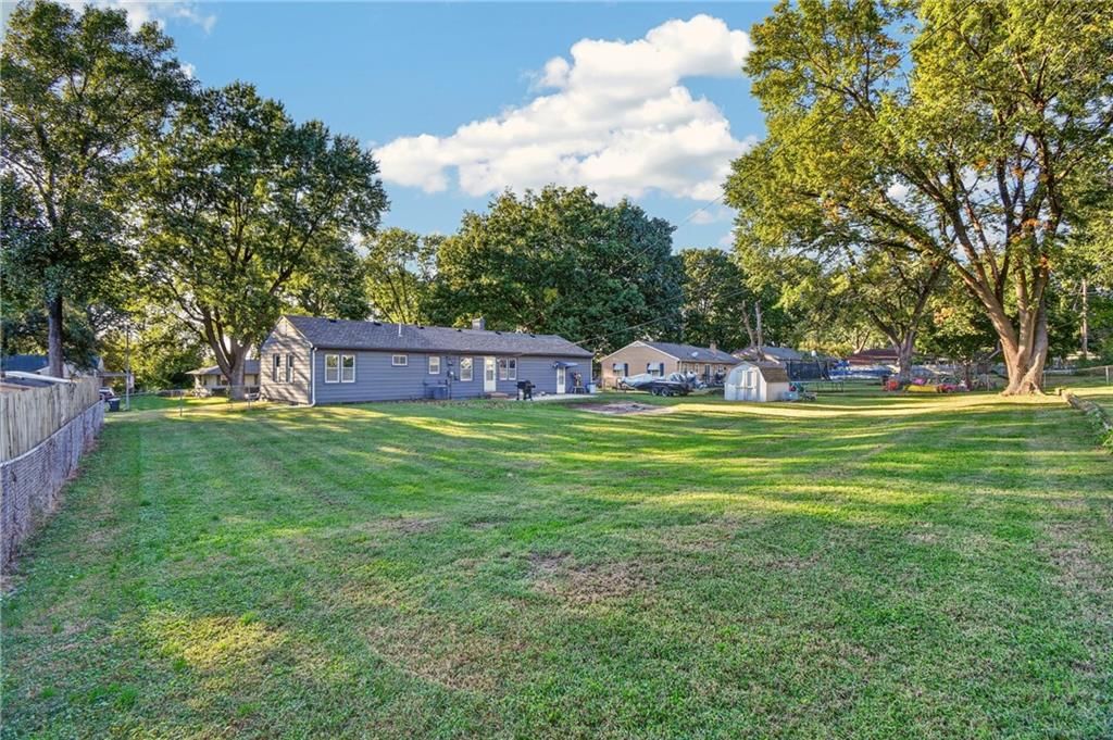 Big backyard, fenced yard and mature trees at 4515 Crisp Avenue, Kansas City, MO 64133