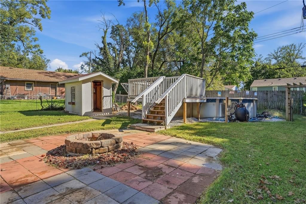 In-ground pool, big backyard and fenced yard at 9009 E 68th Street, Raytown, MO 64133