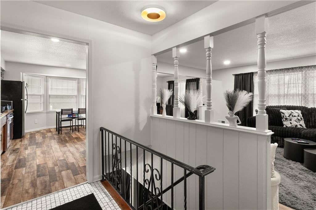 Wainscoting or board and batten, shiplap / paneling and staircase at 8435 E 56th Terrace, Kansas City, MO 64129