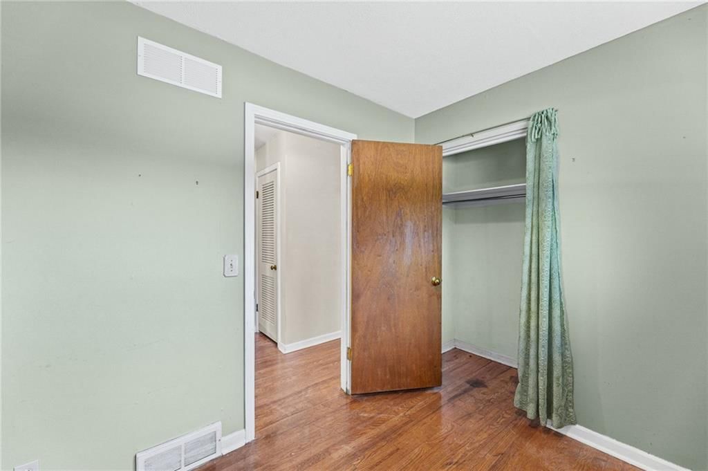 Main-floor primary bedroom at 5718 W 75th Terrace, Prairie Village, KS 66208