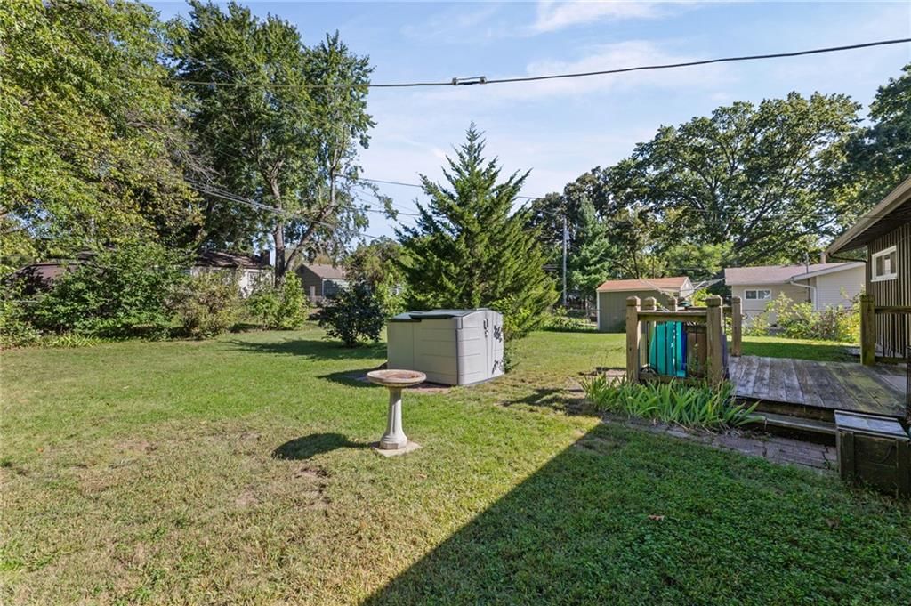 Big backyard, mature trees and hot tub at 5718 W 75th Terrace, Prairie Village, KS 66208