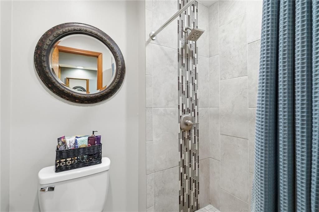Walk-in shower and tiled shower at 14715 S Arapaho Drive, Olathe, KS 66062