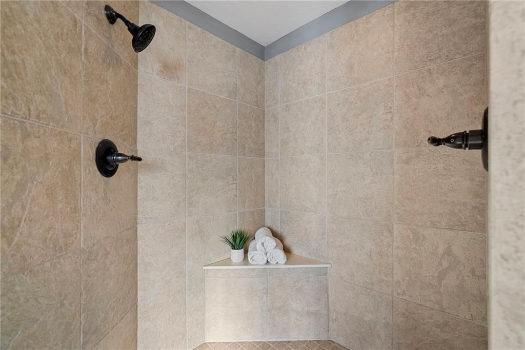 Walk-in shower and tiled shower at 8614 Houston Street, Lenexa, KS 66227