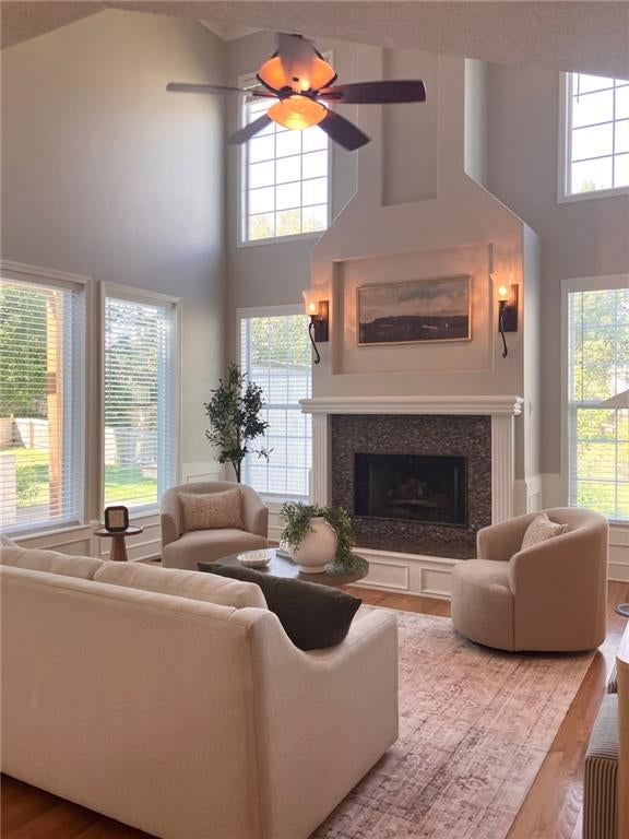 Tall ceilings, fireplace and wall of windows at 8925 W 132nd Terrace, Overland Park, KS 66213