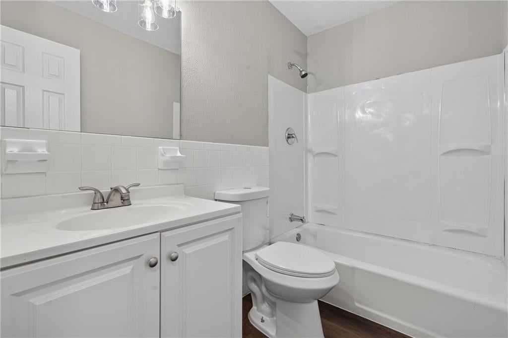 Wainscoting or board and batten and renovated bathrooms at 12001 E 57th Street, Kansas City, MO 64133